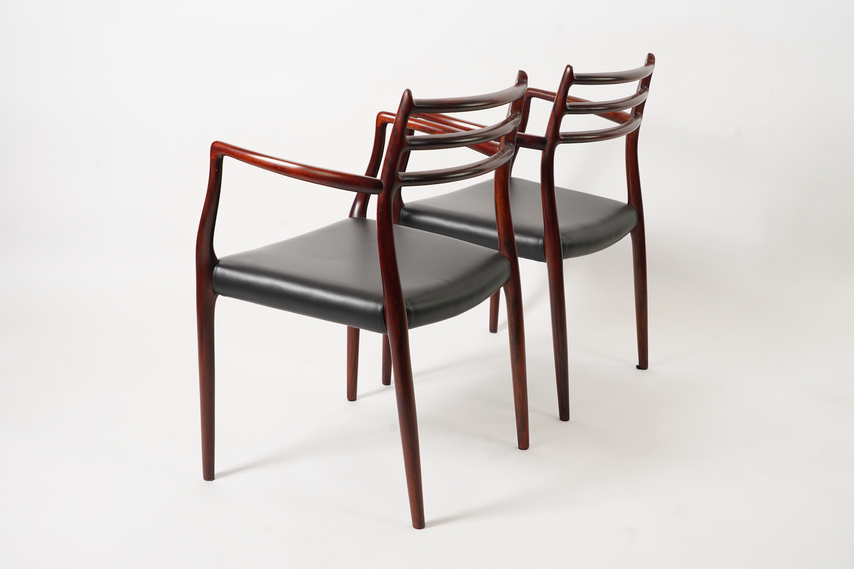 Niels Otto Møller (Danish, 1920-1982) for JL Møllers Møbelfabrik: A pair of 'Model 62' carver chairs